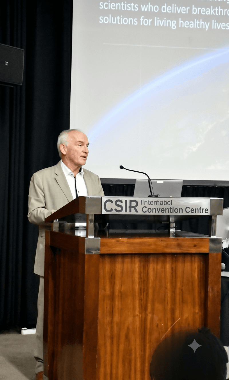 Speaker presenting planetary health research at the CSIR International Convention Centre